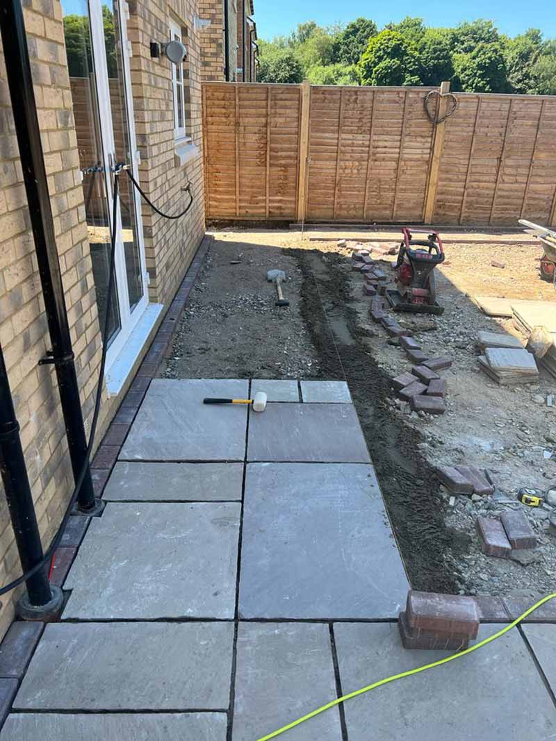 Indian Sandstone With Black Paving Edges and New Turf - Canterbury, Kent