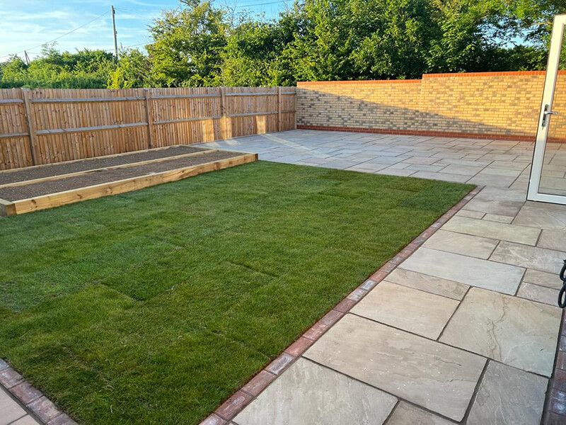 Indian Sandstone With Black Paving Edges and New Turf - Canterbury, Kent