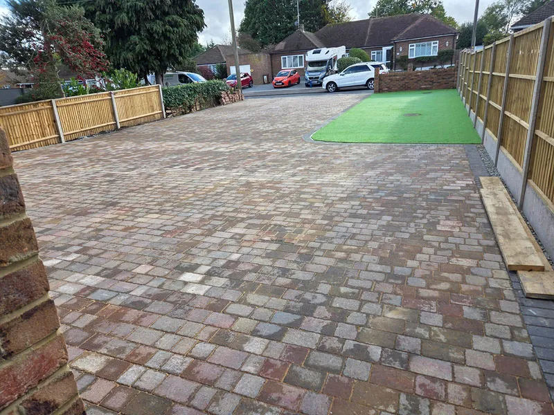 Large block paved driveway providing off road parking for several cars in Kent