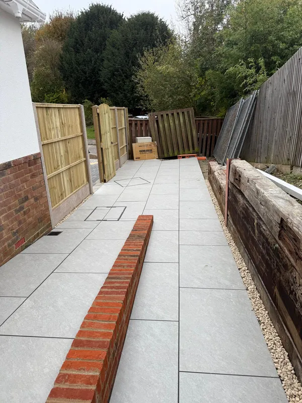 Finished porcelain path with a drainage channel and a side gate, Kent