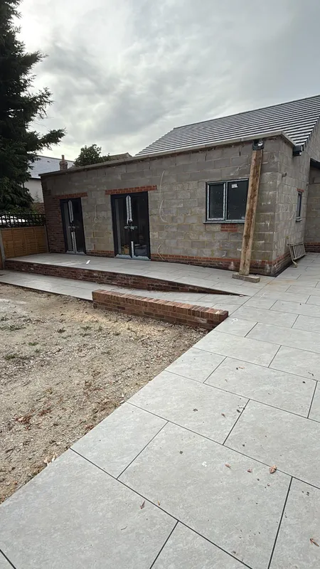 Porcelain slabs part laid across a new patio area during installation in Kent