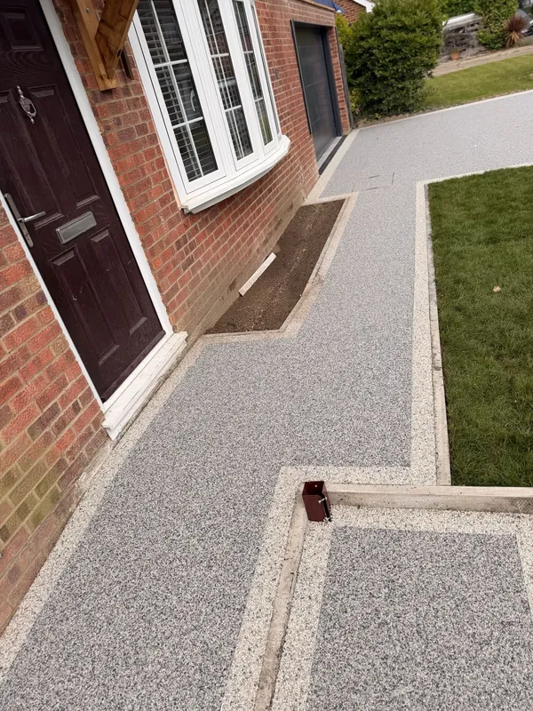 Resin bound path with a porcelain slab step at the front door, Kent