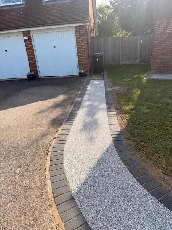 Resin bound drive and path finished in front of a double garage in Kent