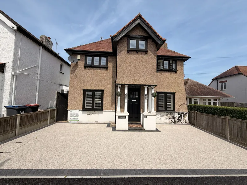 Finished resin bound driveway in a light cream blend outside a detached Kent home
