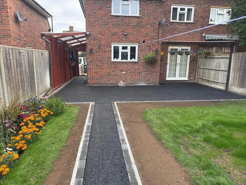 Tarmac base and kerb edging prepared for a new resin bound garden path in Kent